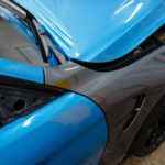 blue vinyl wrap on gray car
