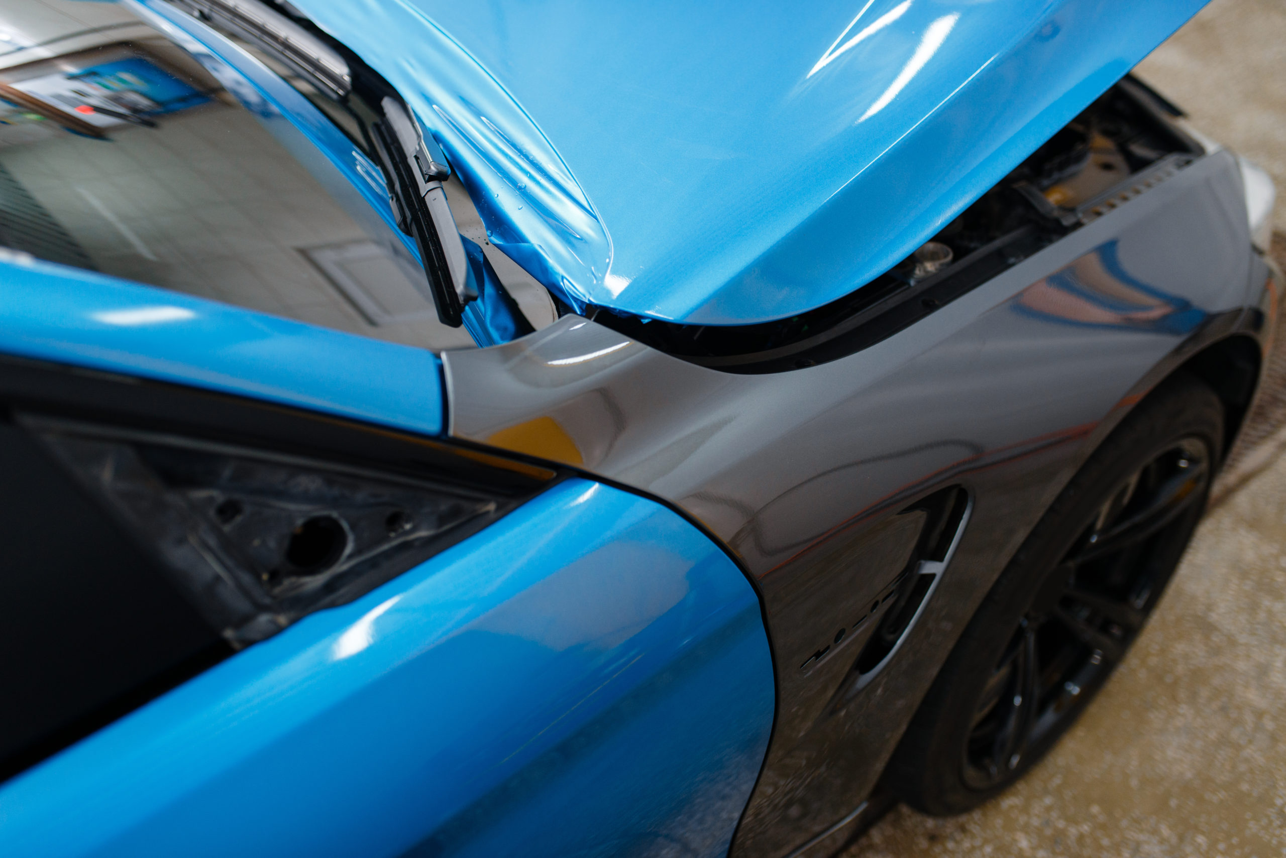blue vinyl wrap on gray car